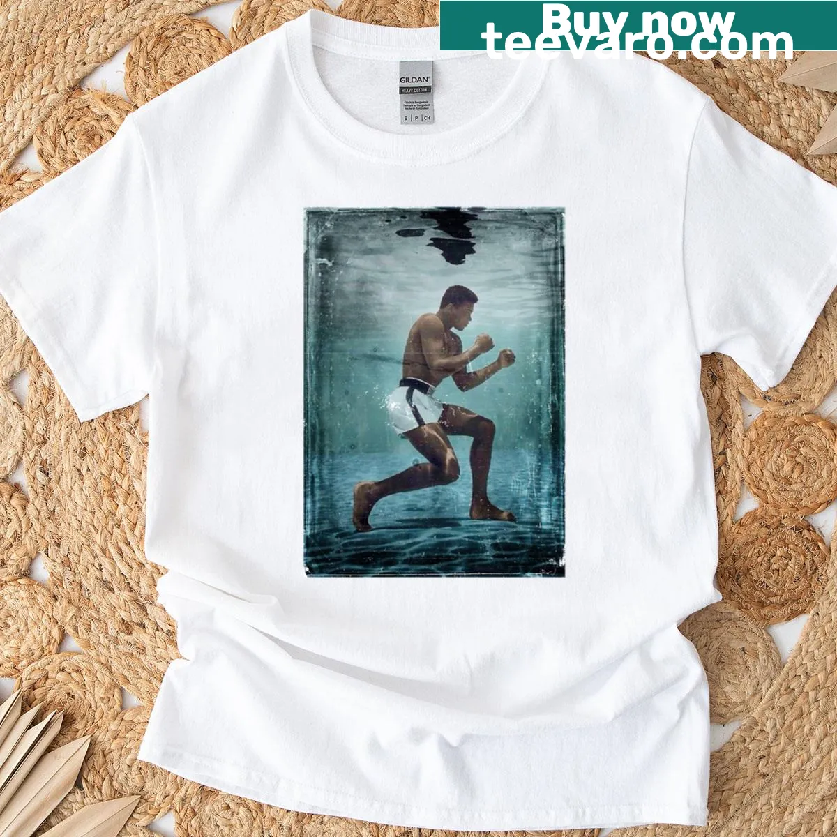 Vintage graphic of Muhammad Ali on a T-shirt celebrating his boxing legacy. — on a men's t-shirt