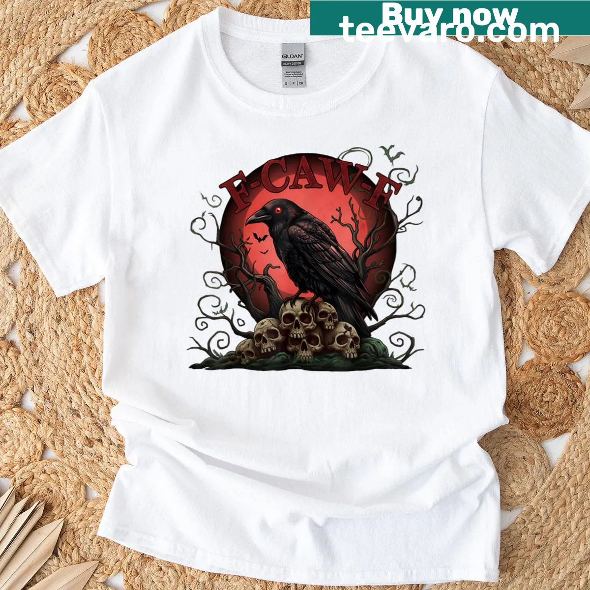 Halloween Tee with a raven and skull pile illustration — on a men's t-shirt