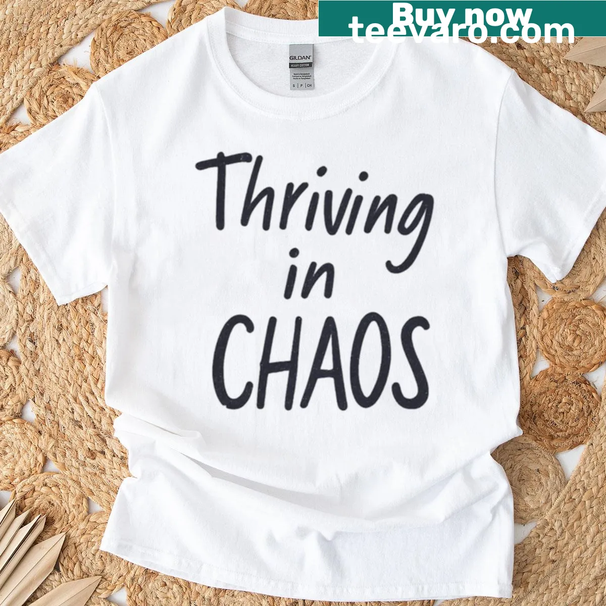 Fitted t-shirt with distressed 'Thriving In Chaos' text design — on a men's t-shirt