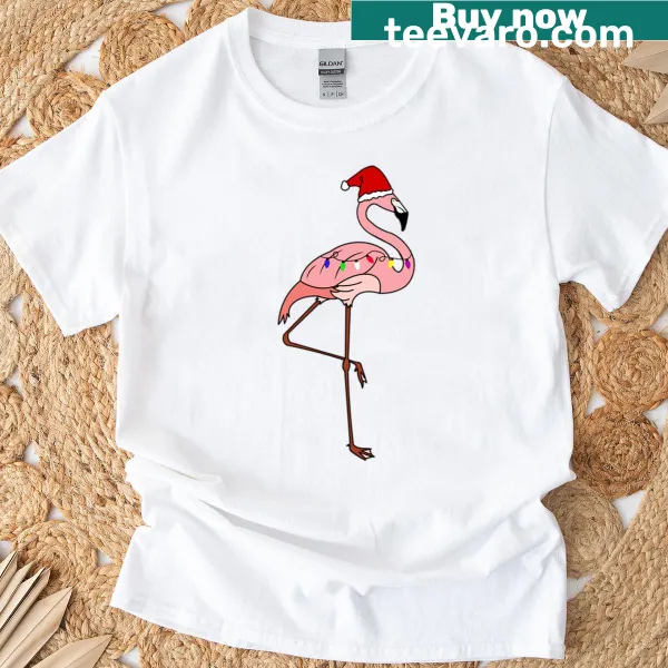 Tropical-themed oversized T-shirt featuring Santa and a pink flamingo with lights
