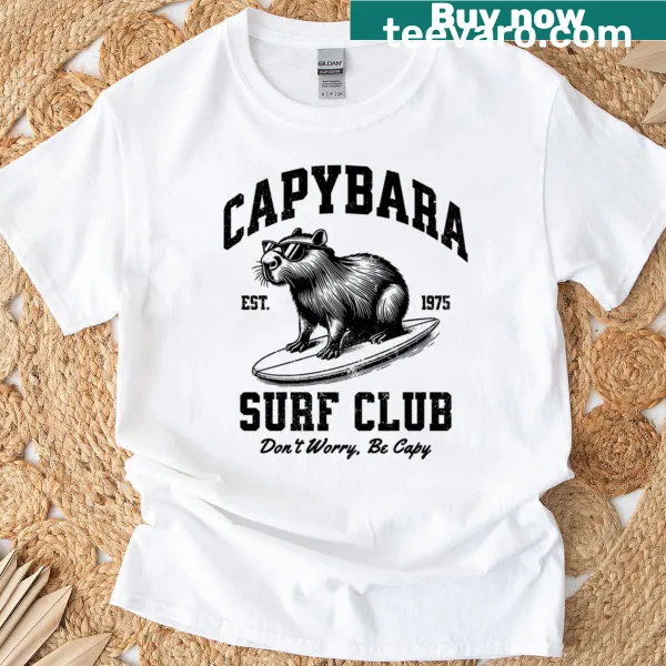 Oversized t-shirt with a cartoon capybara surfing for relaxed wear