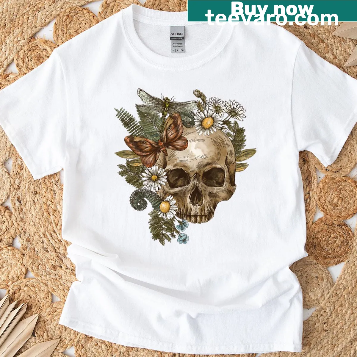 Oversized t-shirt with a vintage skull, flowers, and insect artwork — on a men's t-shirt