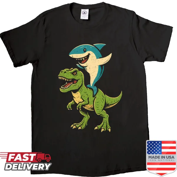 Cartoon graphic of a shark riding a T-Rex dinosaur on a shirt