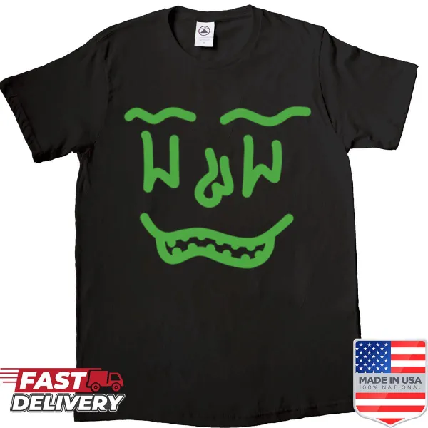 Playful green doodle face graphic on a casual shirt