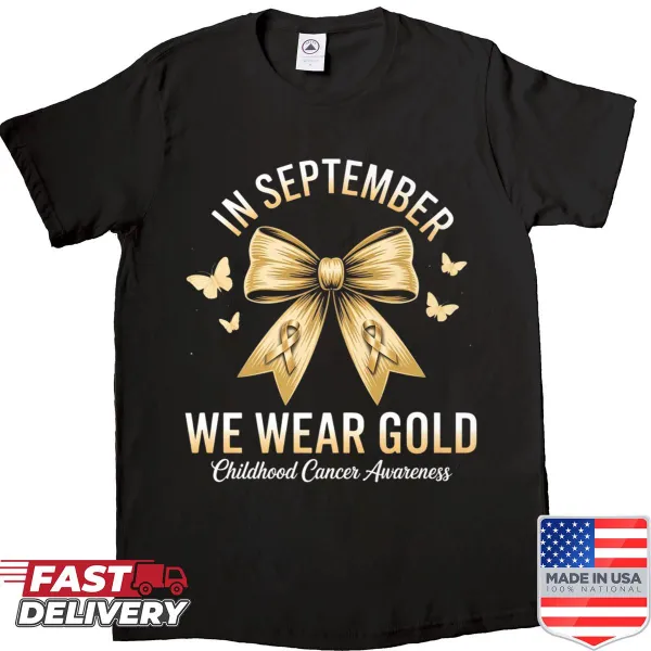 Gold bow and typography for childhood cancer awareness on a shirt