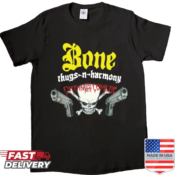 Edgy graphic shirt featuring a skull and guns design.