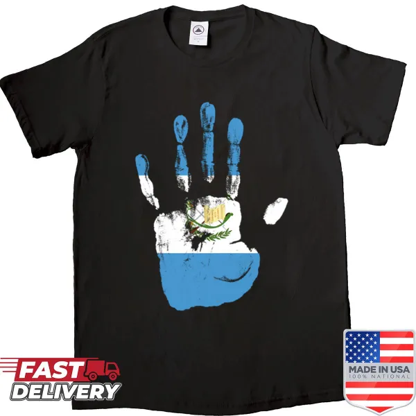 Shirt featuring a hand holding the Guatemala flag with palm elements