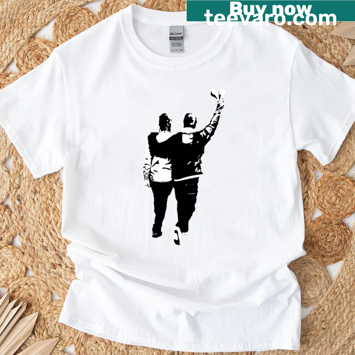 Graphic T-shirt featuring fallen guns, emphasizing themes of peace and change. — on a men's t-shirt