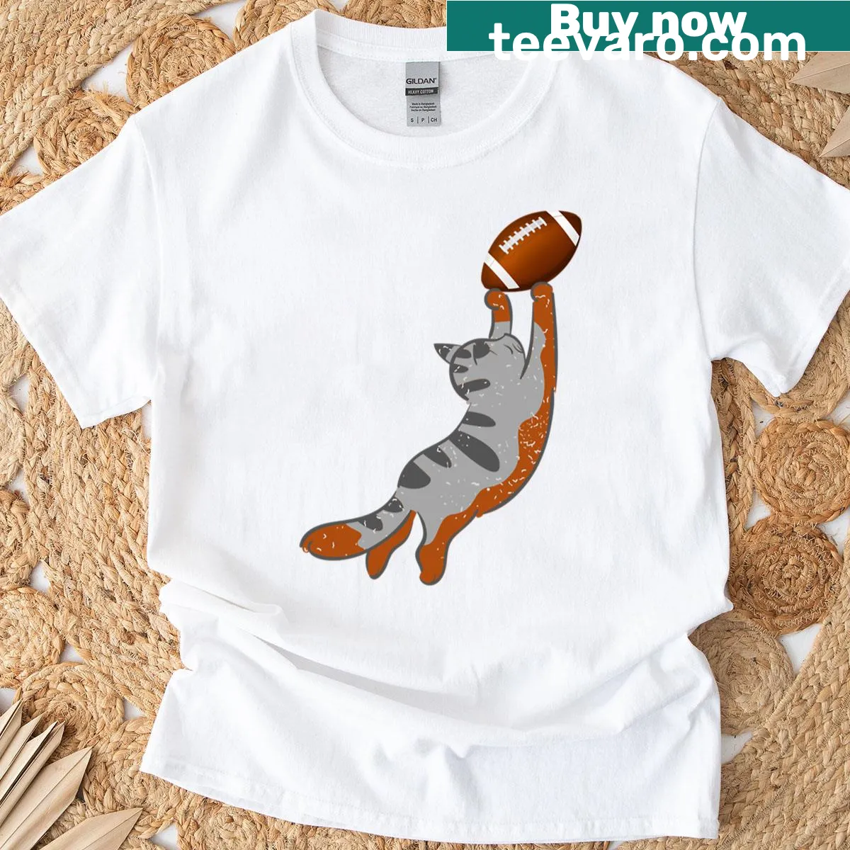 Cat holding football t-shirt design — on a men's t-shirt