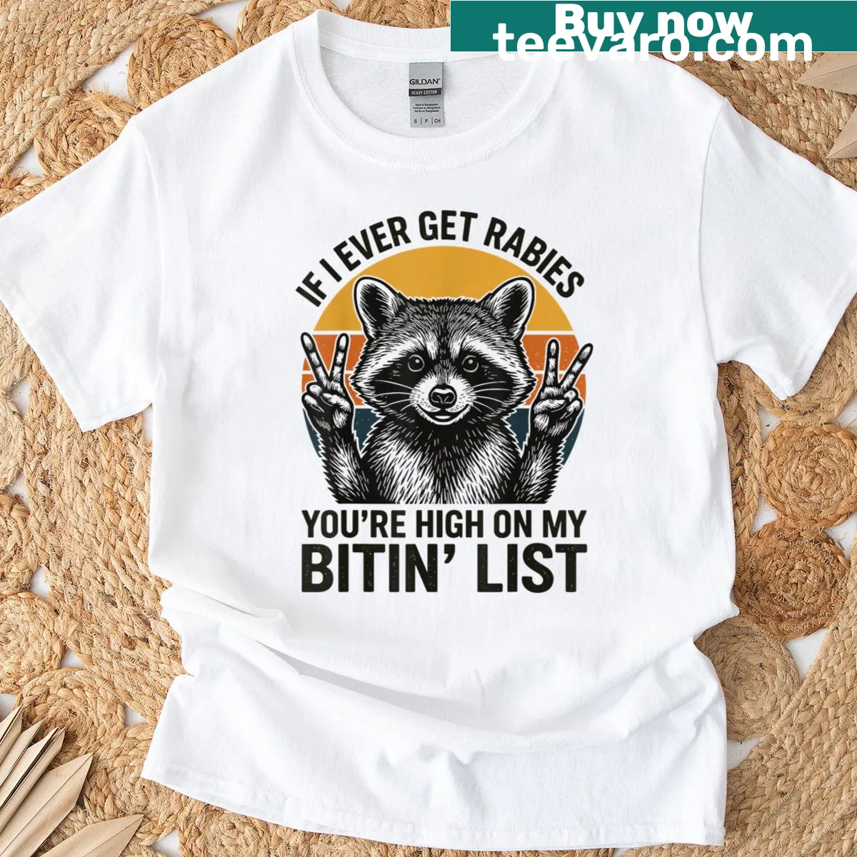 Graphic tee featuring a cheeky raccoon and humorous biting list phrase — on a men's t-shirt