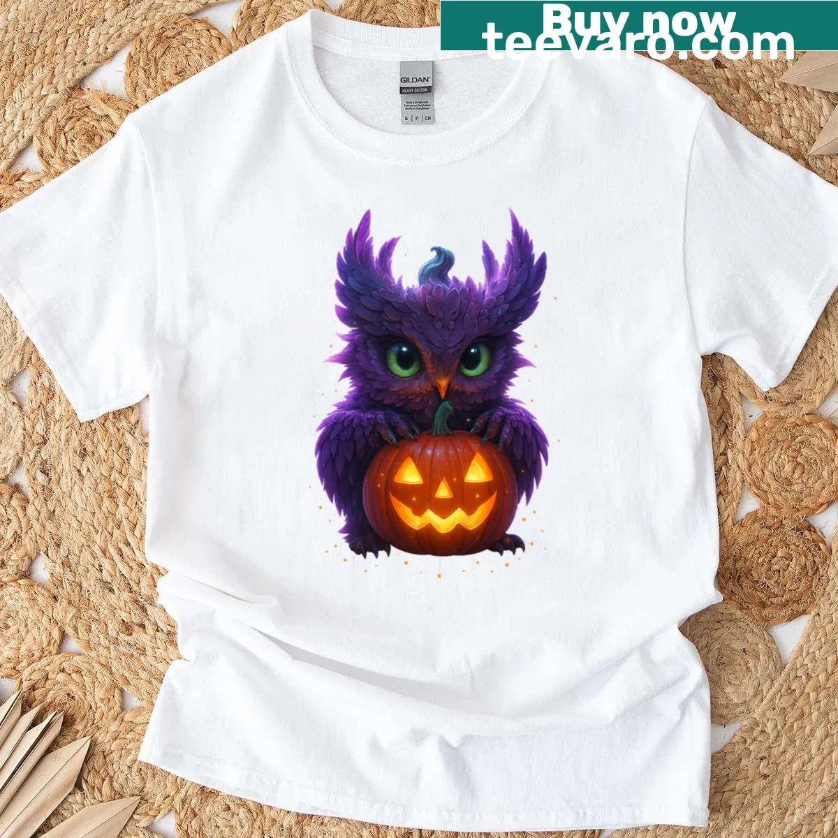 Mystical owl sitting on a glowing pumpkin in Halloween-themed art. — on a men's t-shirt