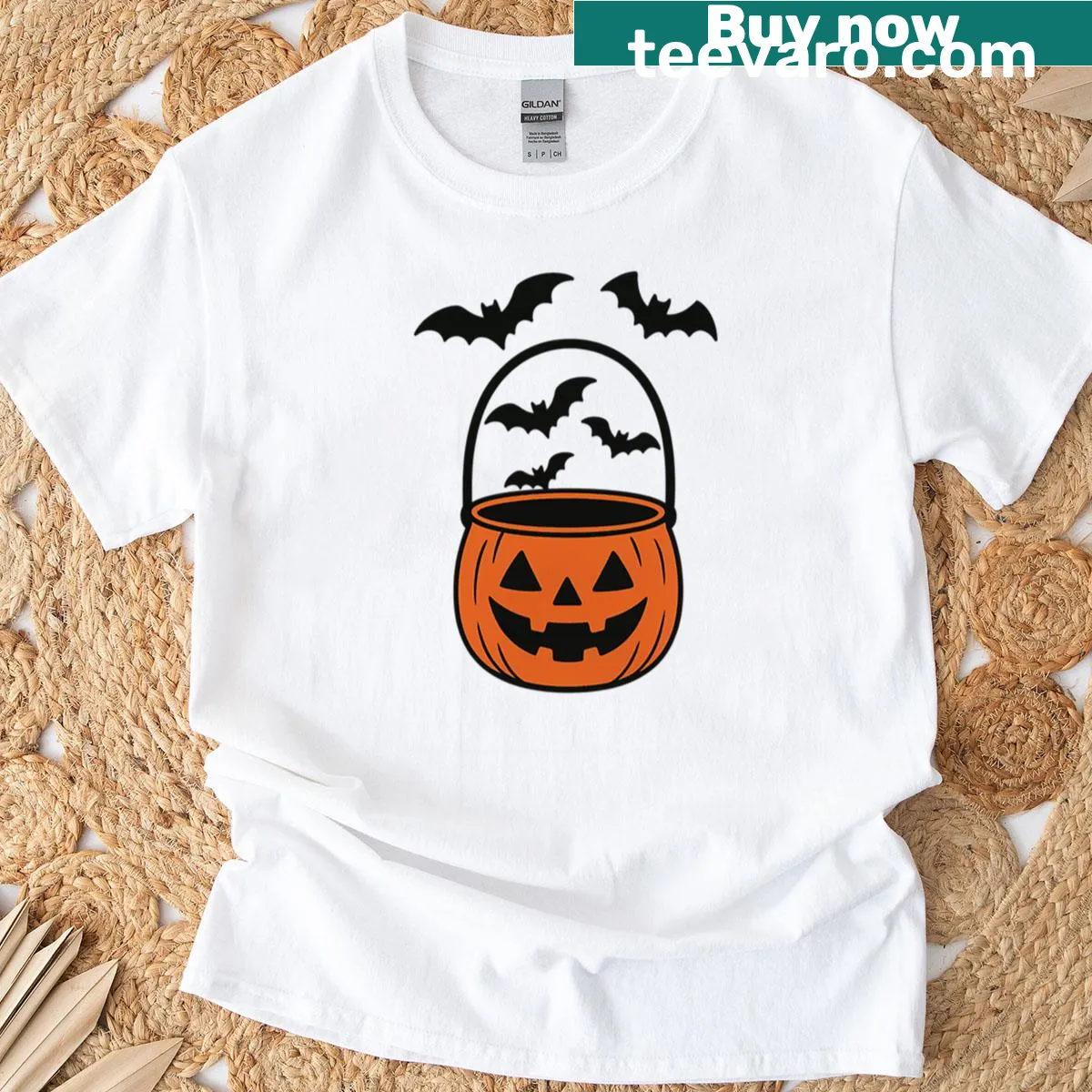 Halloween oversized T-shirt with pumpkin candy bucket and bats design. — on a men's t-shirt