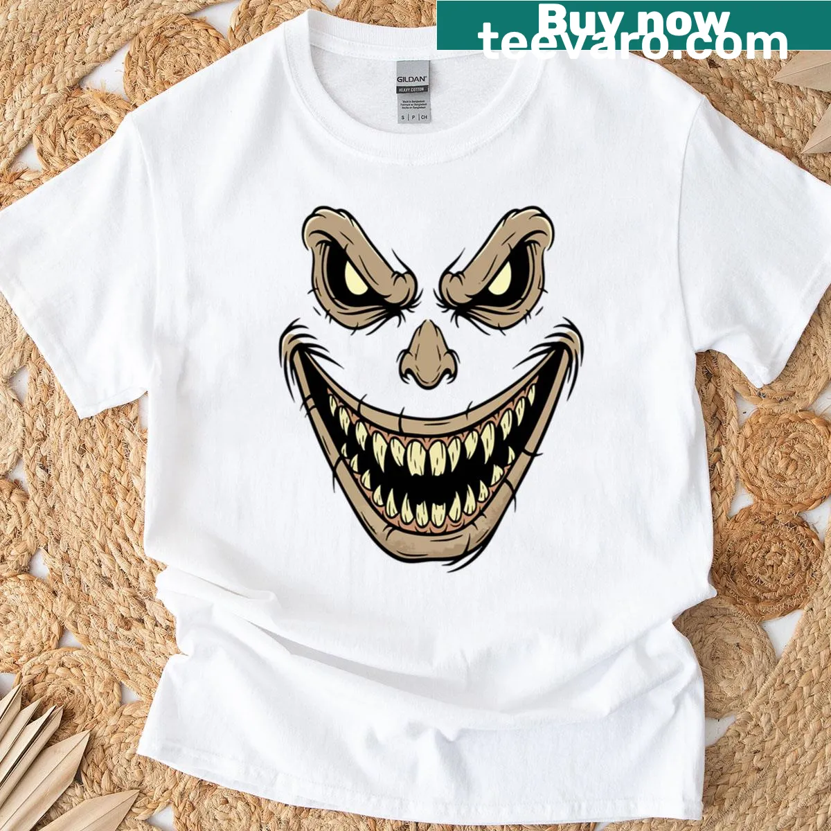 Oversized T-shirt featuring a spooky scarecrow face design. — on a men's t-shirt