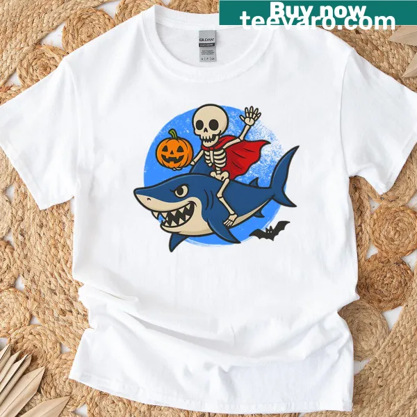 Whimsical skeleton riding a shark graphic on an oversized t-shirt