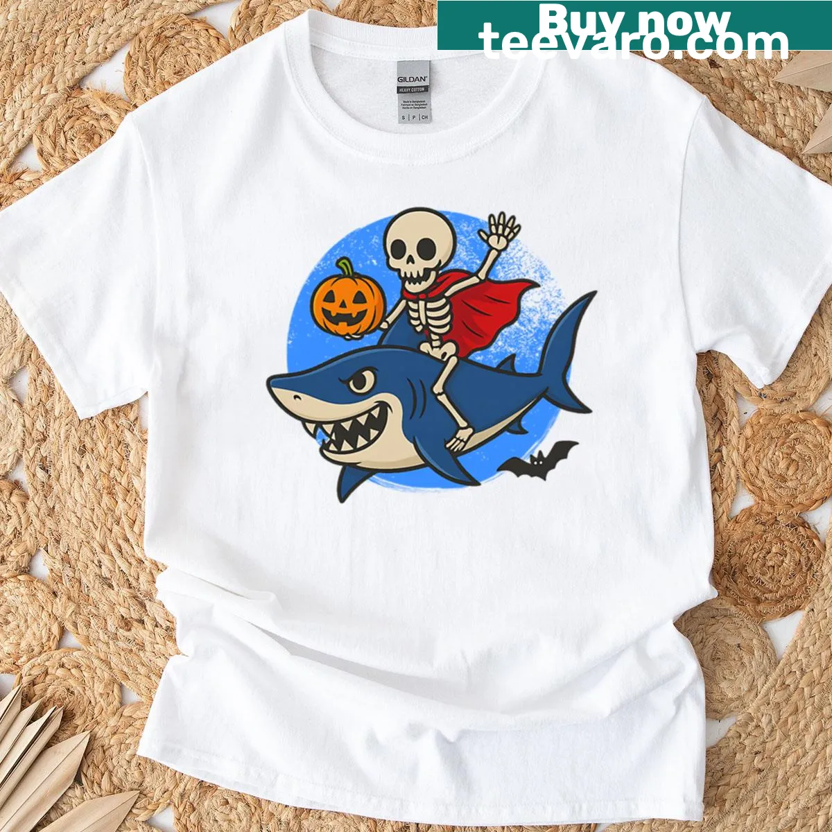 Whimsical skeleton riding a shark graphic on an oversized t-shirt — on a men's t-shirt