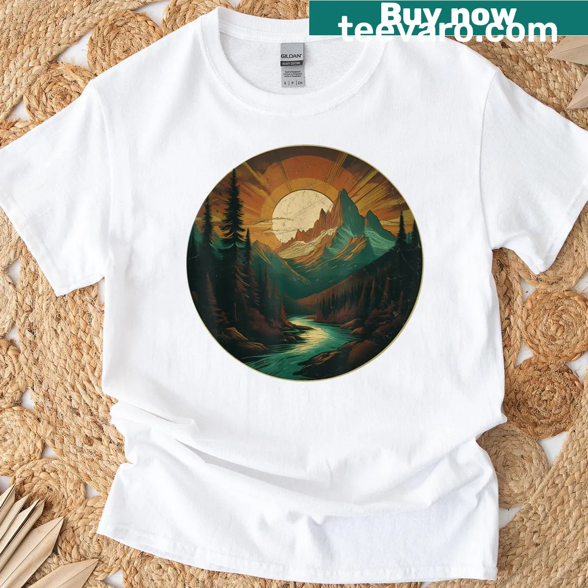 Vintage graphic T-shirt depicting a sunset over mountains and evergreen trees — on a men's t-shirt