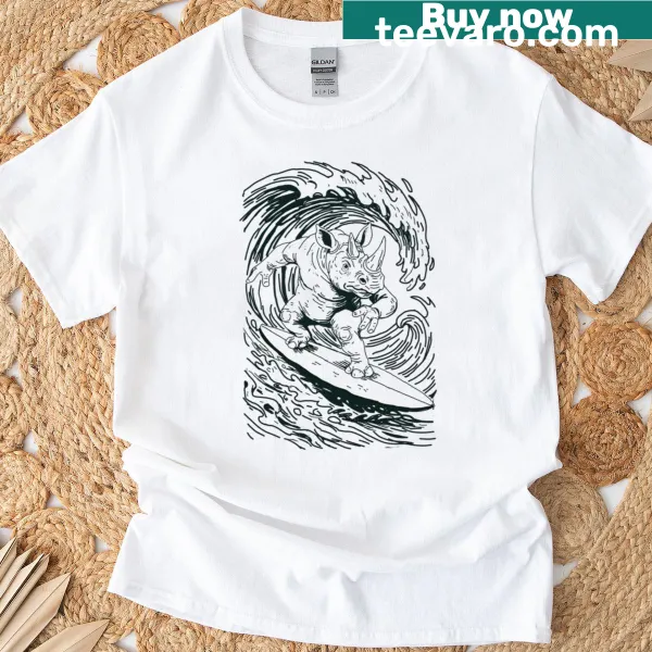 Cartoon rhino surfing through waves on a t-shirt
