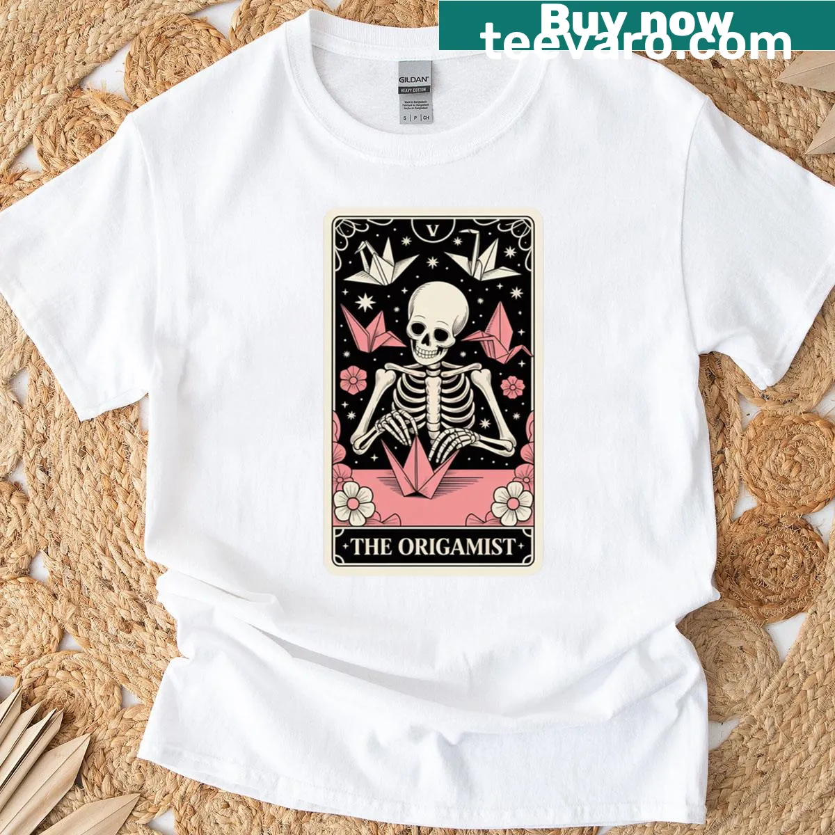 Oversized t-shirt featuring an origami-style skeleton tarot card design. — on a men's t-shirt