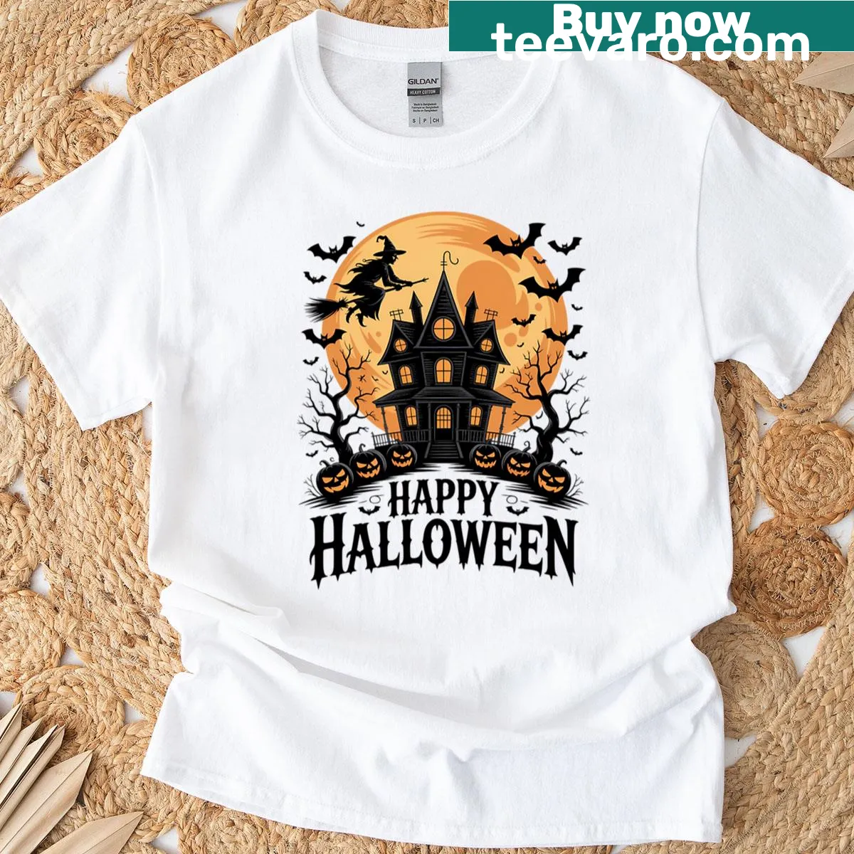 Oversized T-shirt featuring a witch flying over a spooky moon scene. — on a men's t-shirt