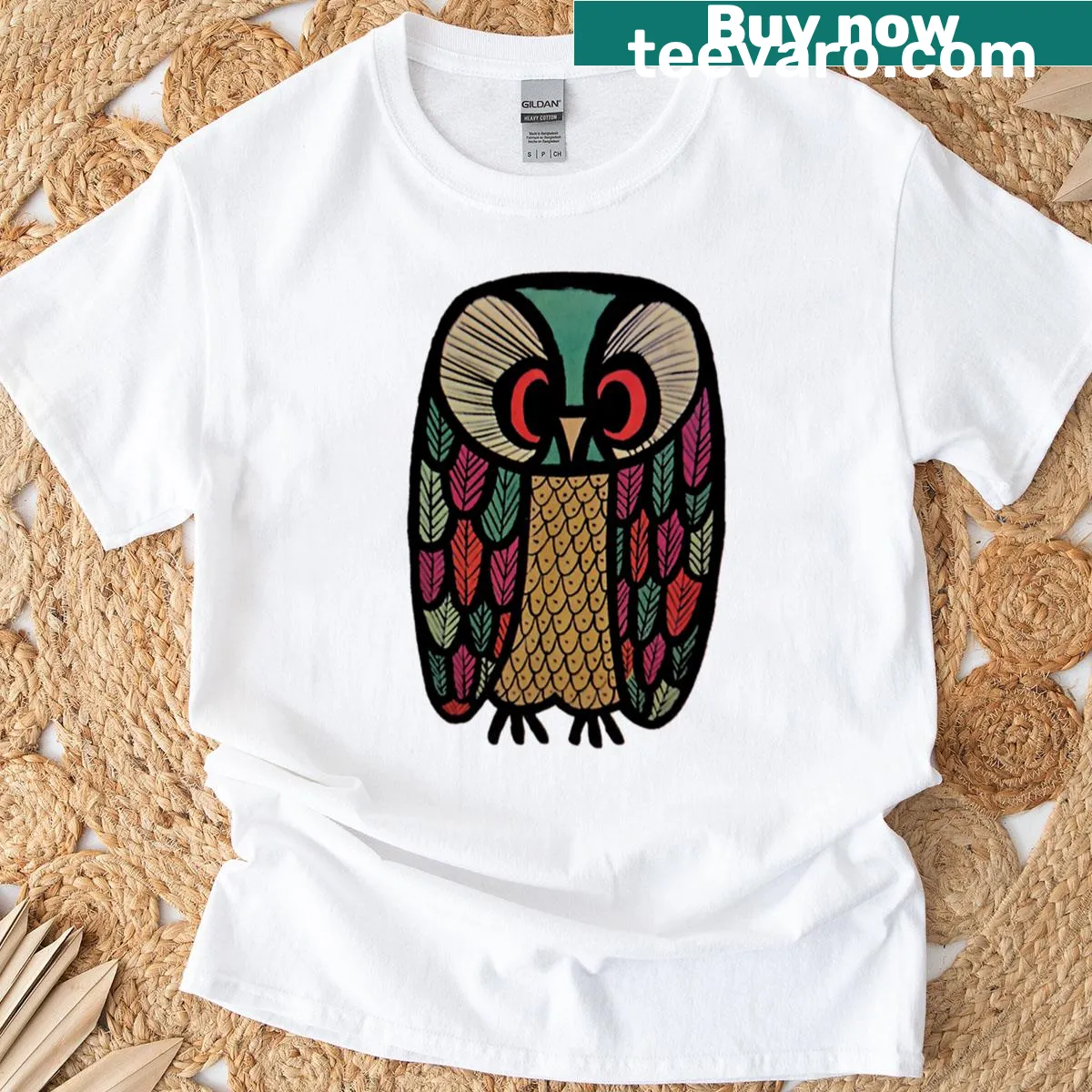 Illustrative t-shirt with a green patchwork owl design — on a men's t-shirt
