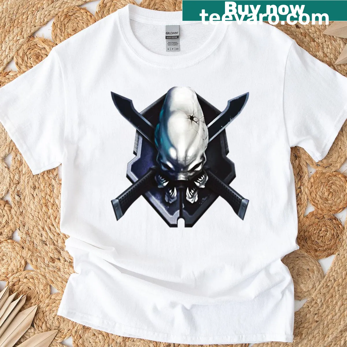 Illustrated skull within a shield design on a T-shirt — on a men's t-shirt