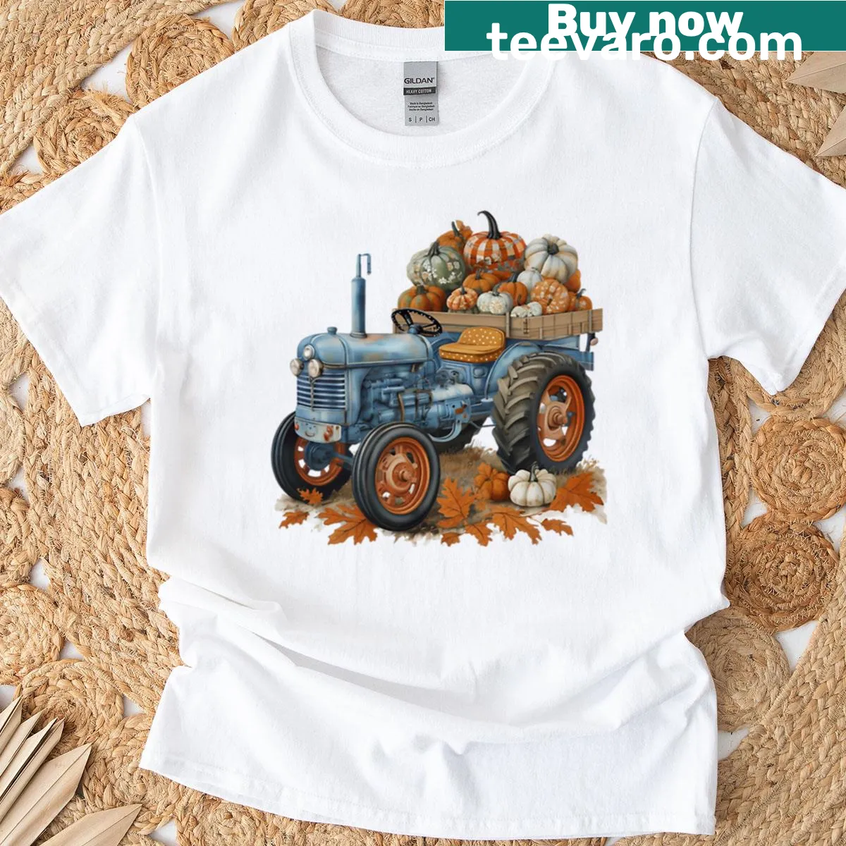 Vintage style T-shirt with a blue tractor in a pumpkin patch — on a men's t-shirt