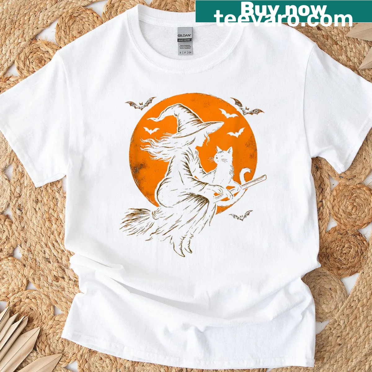T-shirt featuring a cute witch and her black kitten in a playful Halloween design. — on a men's t-shirt