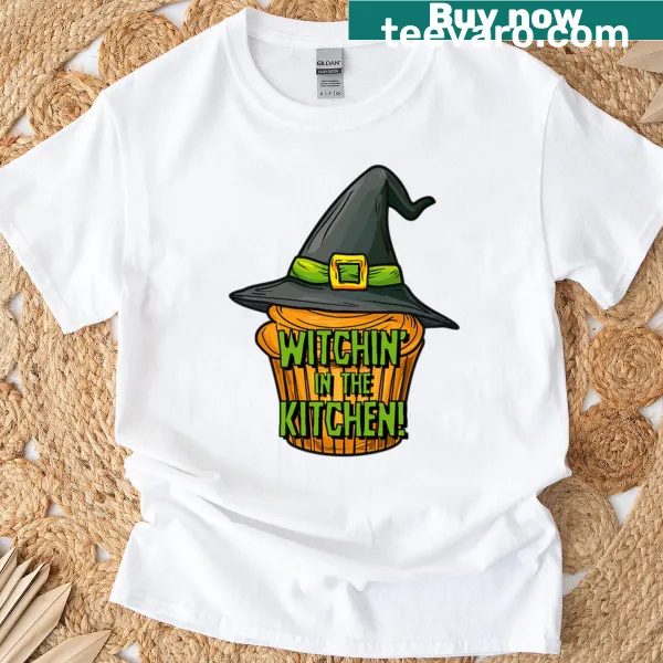 Humorous t-shirt featuring a witch-themed kitchen graphic.
