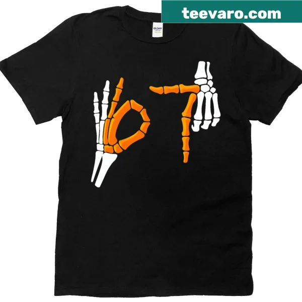 Skeleton hands graphic on Halloween-themed t-shirt