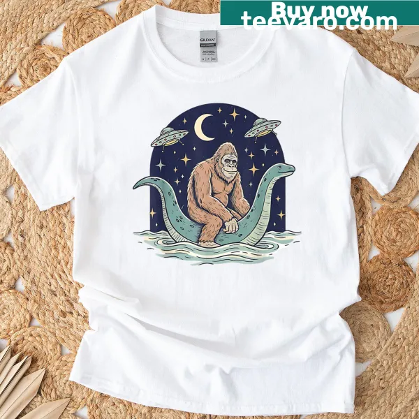 Cartoon design featuring Bigfoot, Loch Ness Monster, and UFOs on a t-shirt