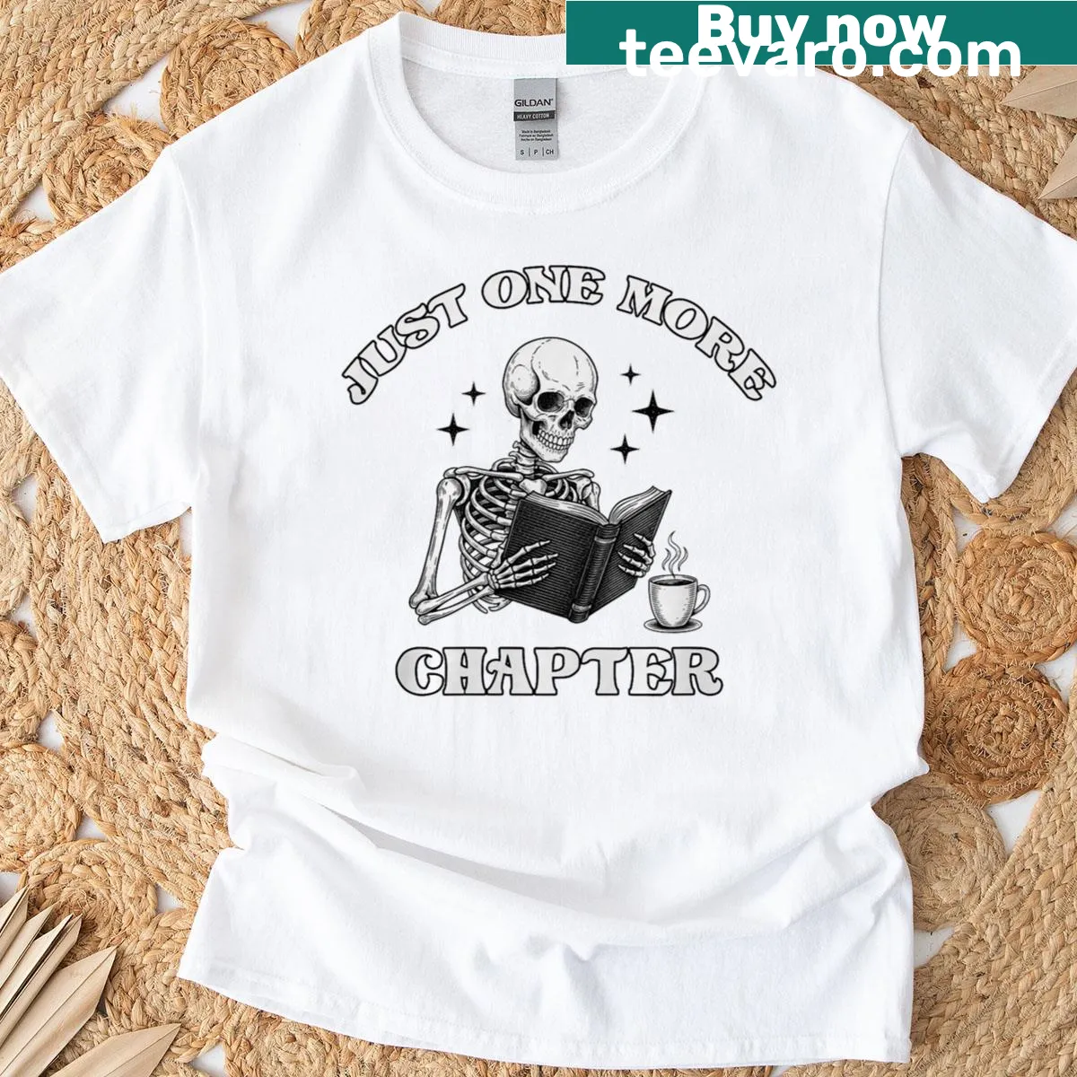 Skeleton reading a book with a Halloween theme t-shirt — on a men's t-shirt