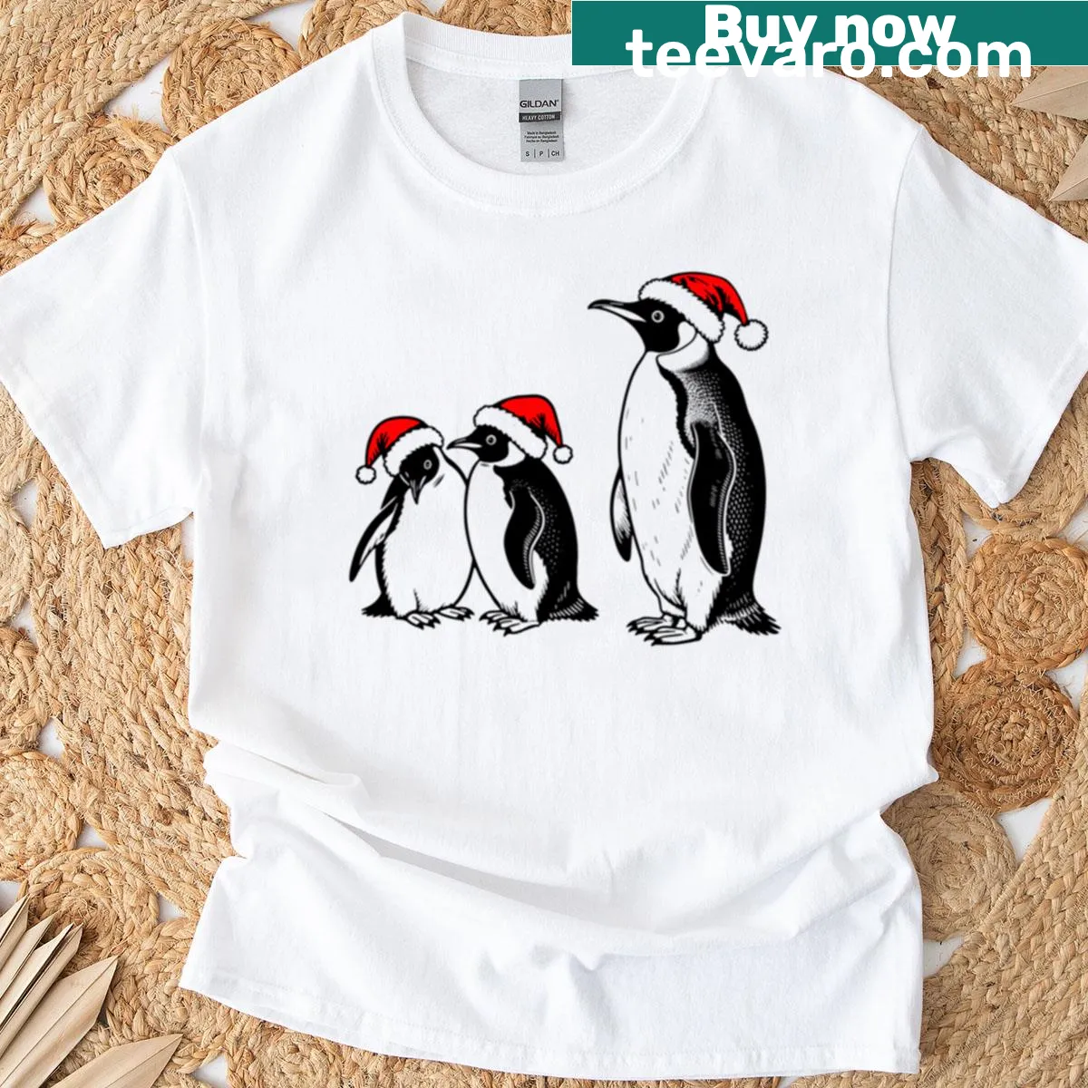 Cartoon penguin wearing a Christmas hat graphic T-shirt — on a men's t-shirt