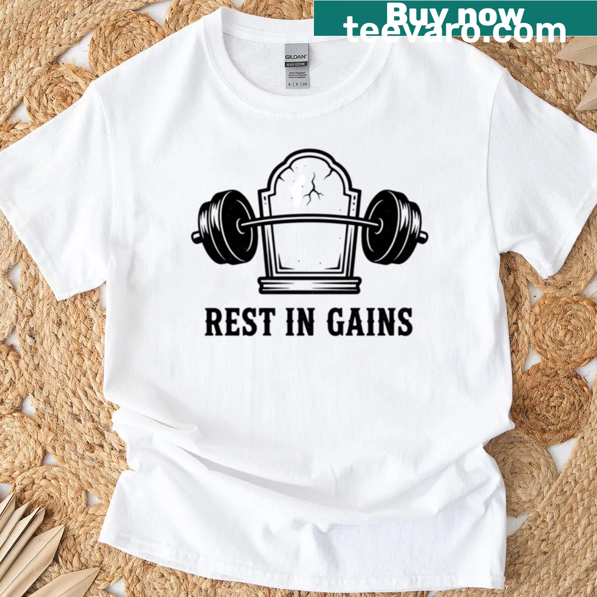 Funny Rest In Gains graphic t-shirt with tombstone and barbell — on a men's t-shirt