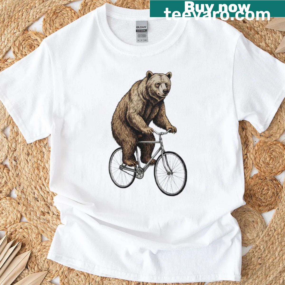 Whimsical vintage illustration of a bear riding a bicycle — on a men's t-shirt