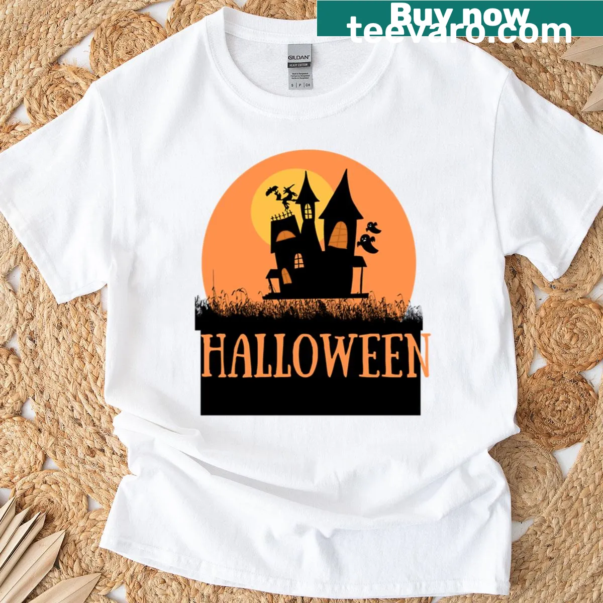 Haunted house silhouette t-shirt with spooky ghost art — on a men's t-shirt