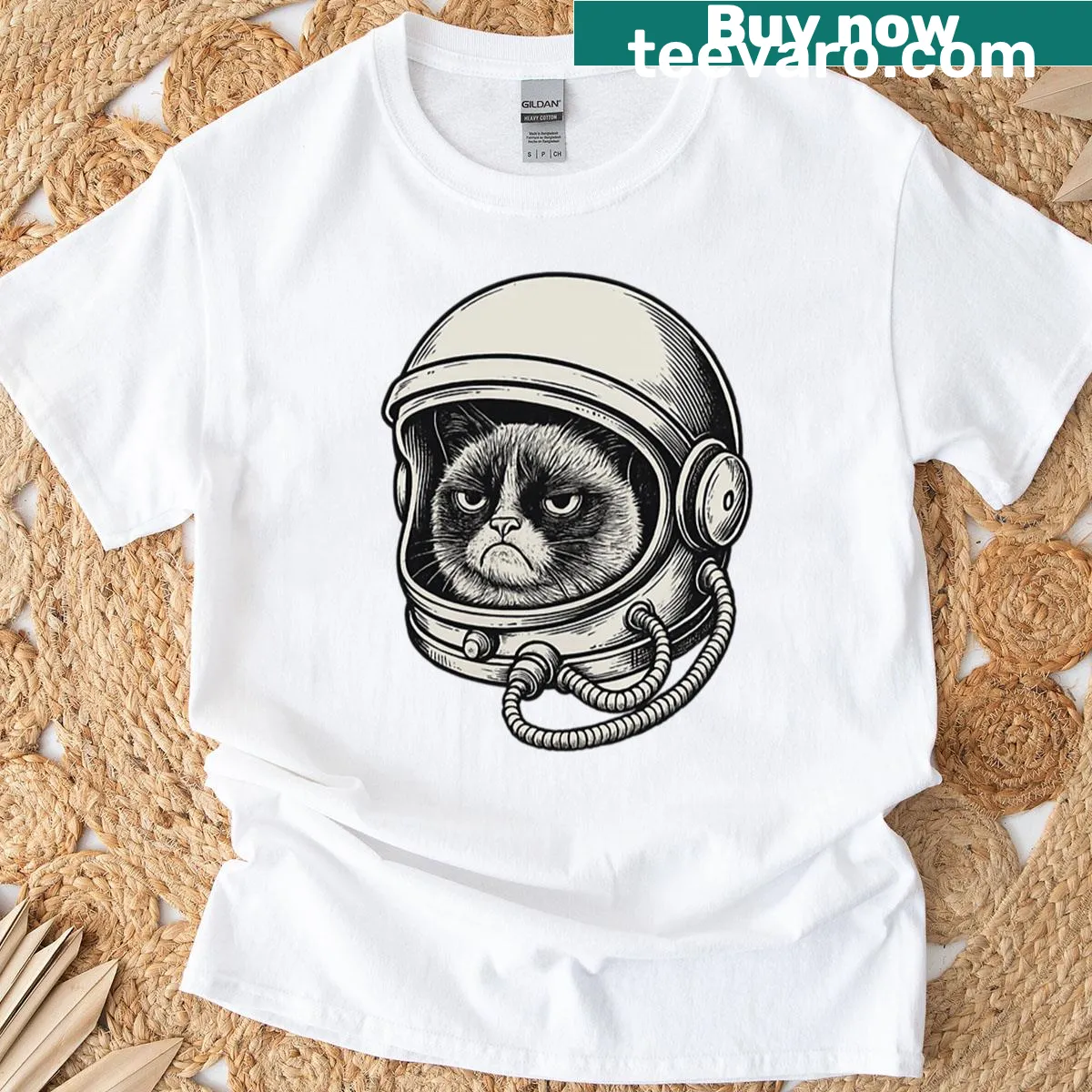 Oversized T-shirt with a whimsical astronaut cat illustration — on a men's t-shirt