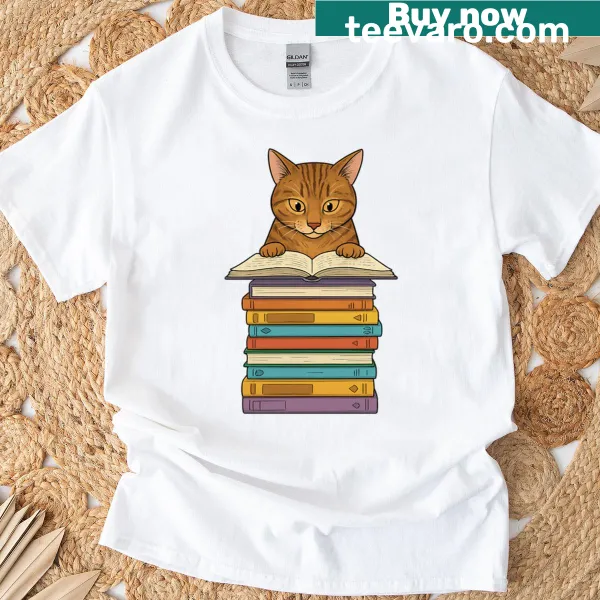 Oversized shirt featuring a tabby cat reading on a pile of books.