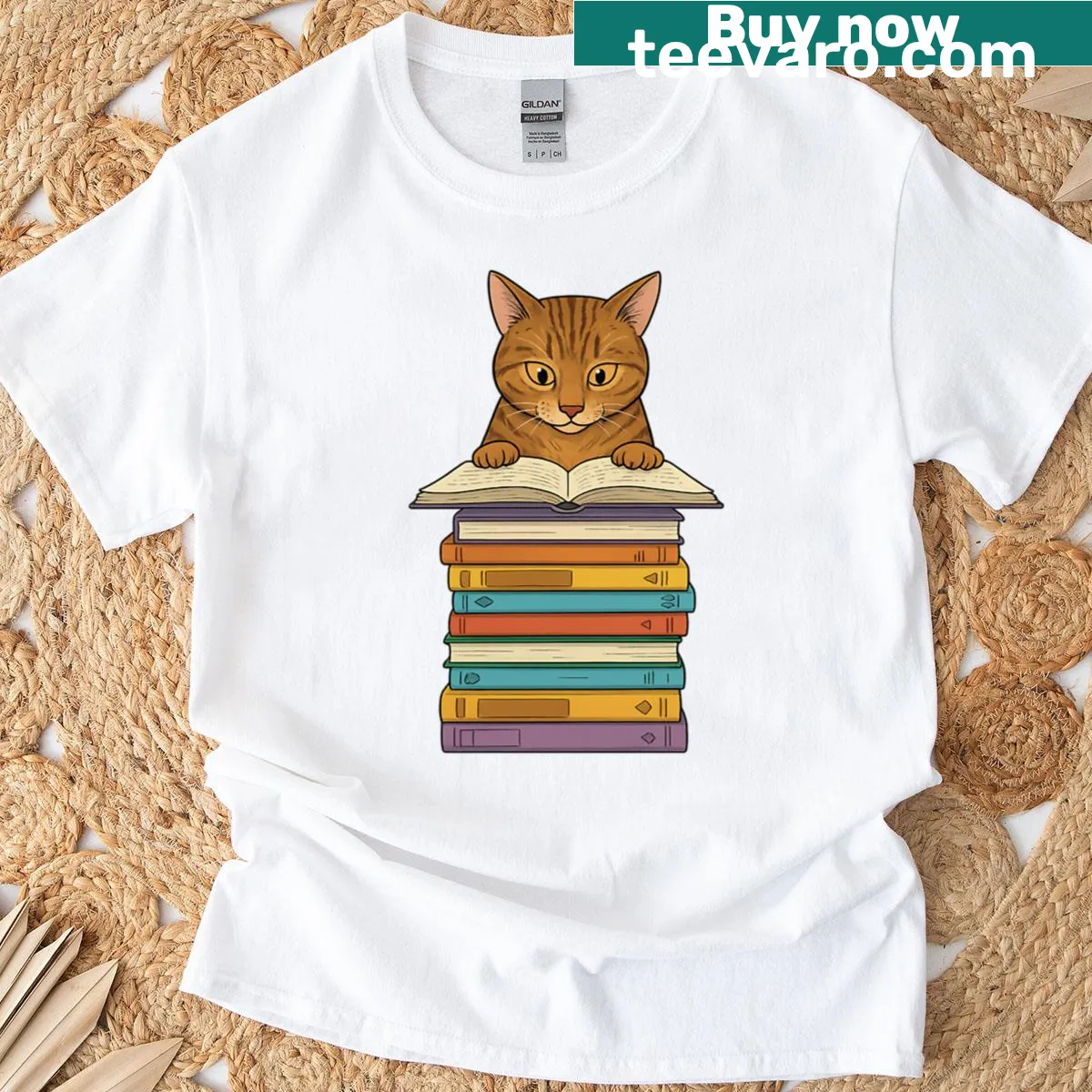 Oversized shirt featuring a tabby cat reading on a pile of books. — on a men's t-shirt