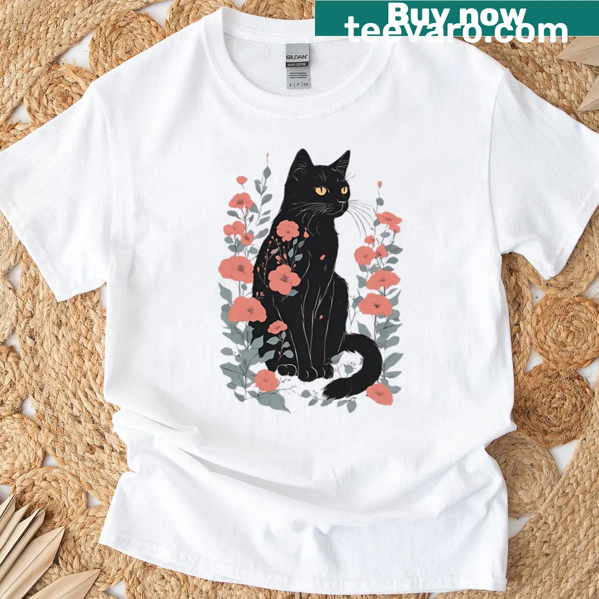 Black cat illustration surrounded by a floral autumn pattern on a T-shirt. — on a men's t-shirt