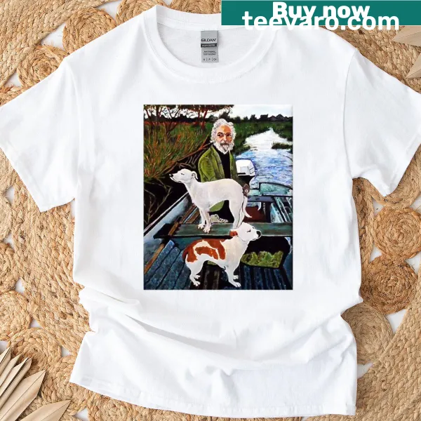 Illustrated t-shirt featuring a man with two dogs in a warm scene.