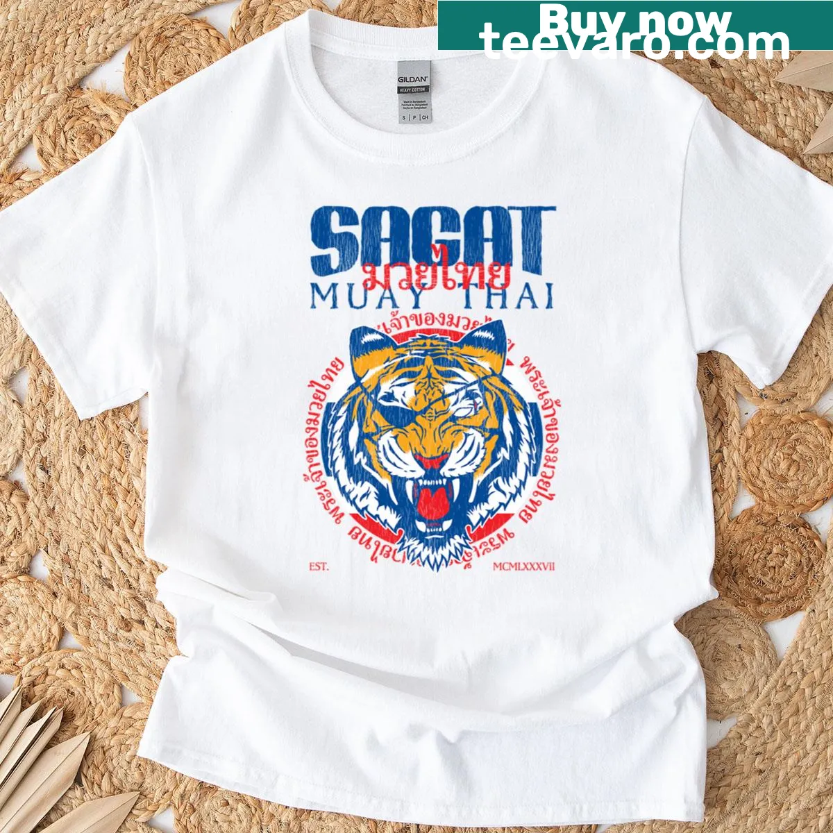 Fierce tiger graphic with Sagat God of Muay Thai text on t-shirt — on a men's t-shirt