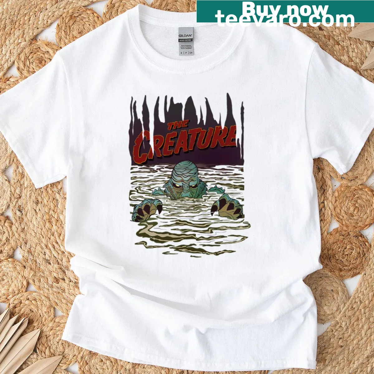 Oversized t-shirt featuring a playful creature illustration — on a men's t-shirt