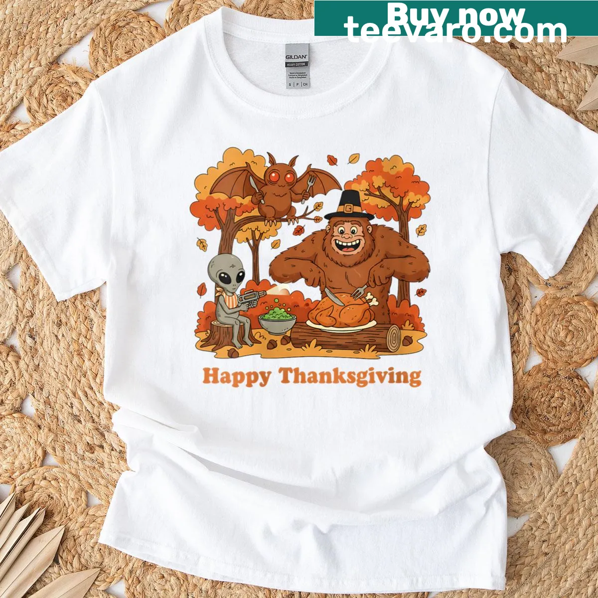 Happy Thanksgiving shirt featuring Bigfoot, Mothman, and aliens celebrating together — on a men's t-shirt