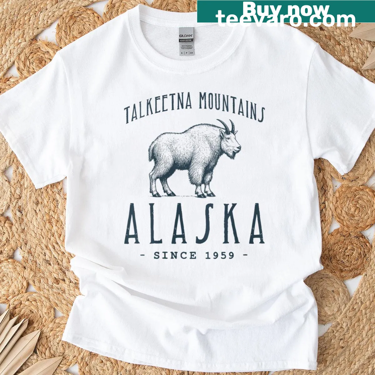 Illustrated Mountain Goat T-shirt featuring Alaskan mountains — on a men's t-shirt
