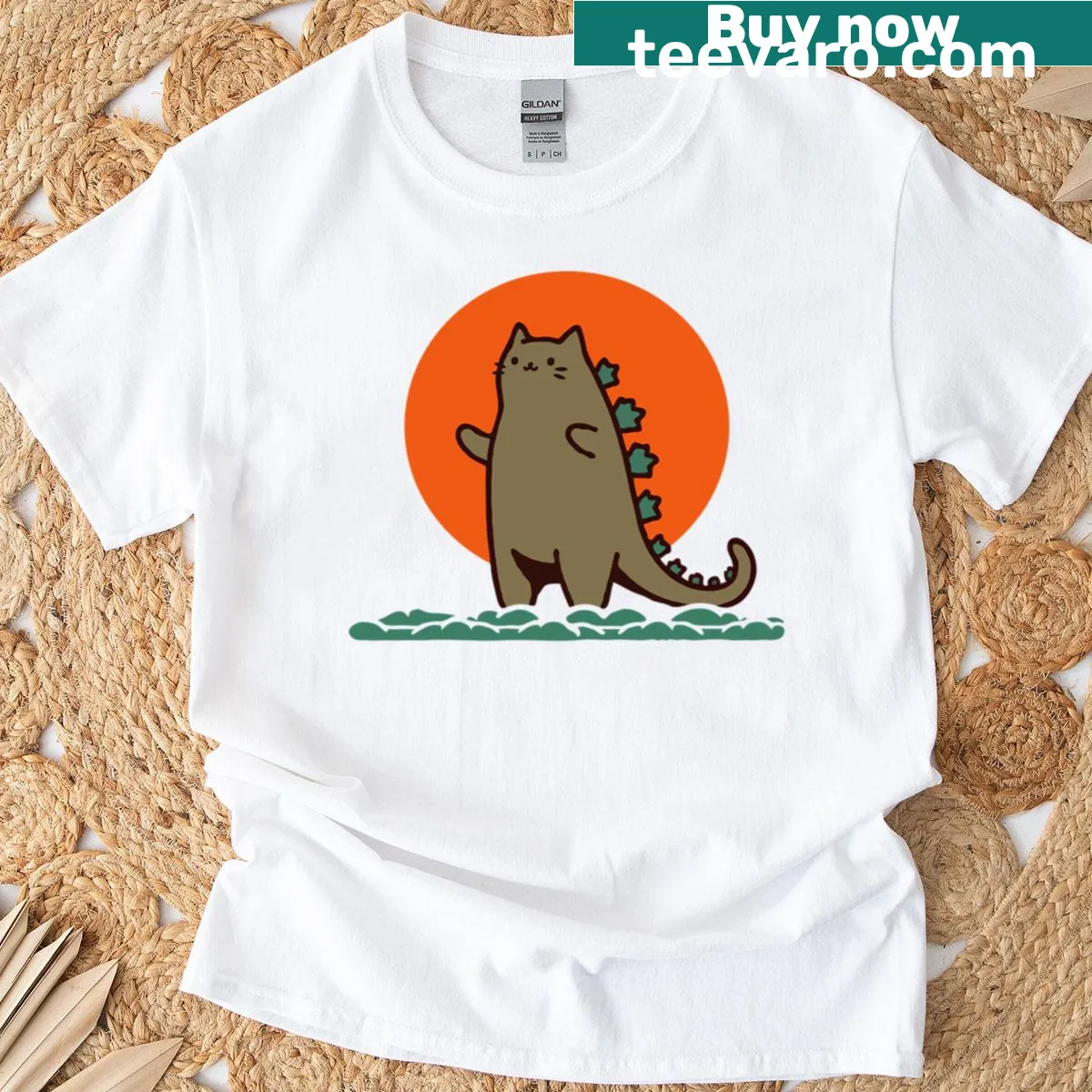 Illustration of Catzilla, a giant cat with an ocean backdrop and sun — on a men's t-shirt