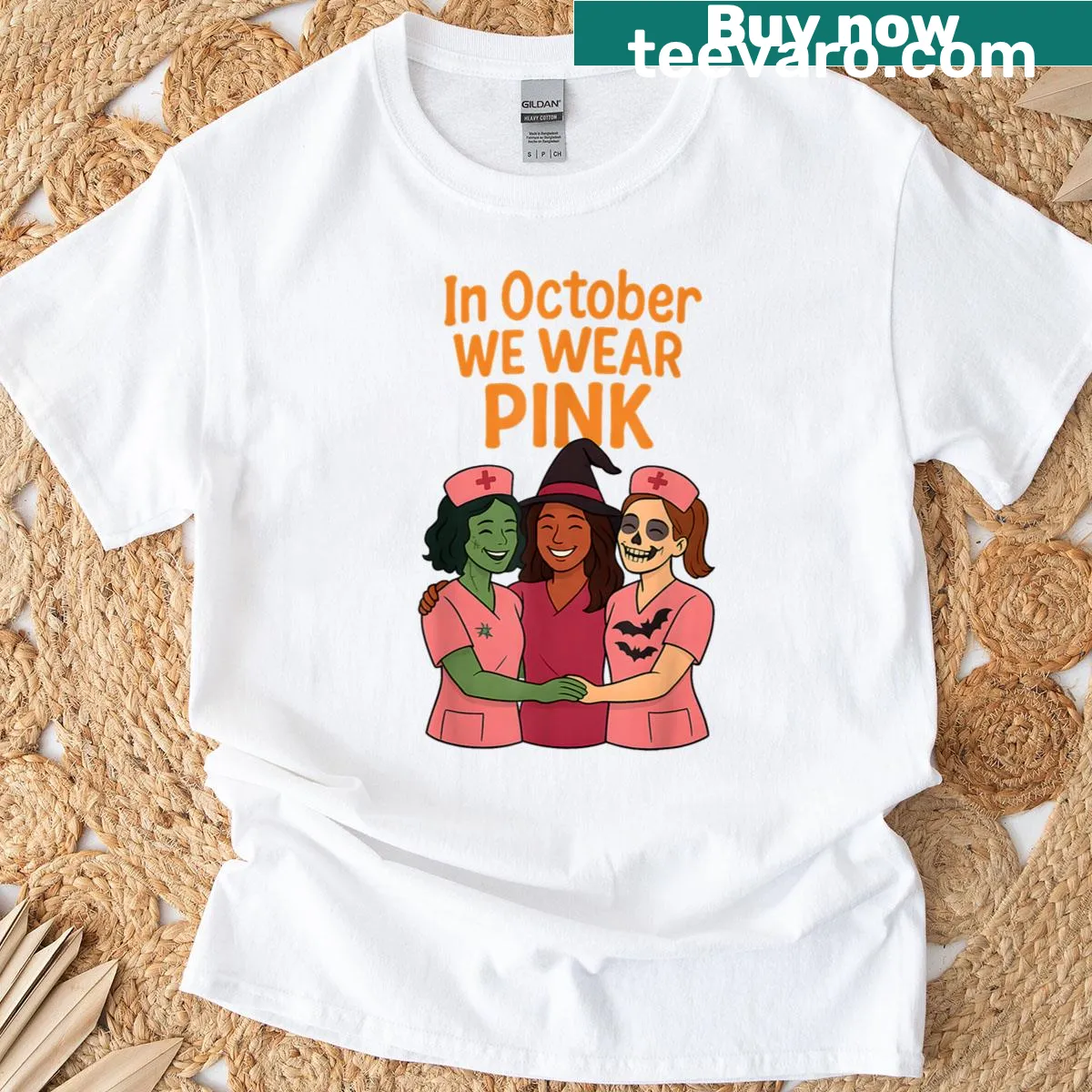 Halloween t-shirt with ghost graphic and 'In October We Wear Pink' text. — on a men's t-shirt