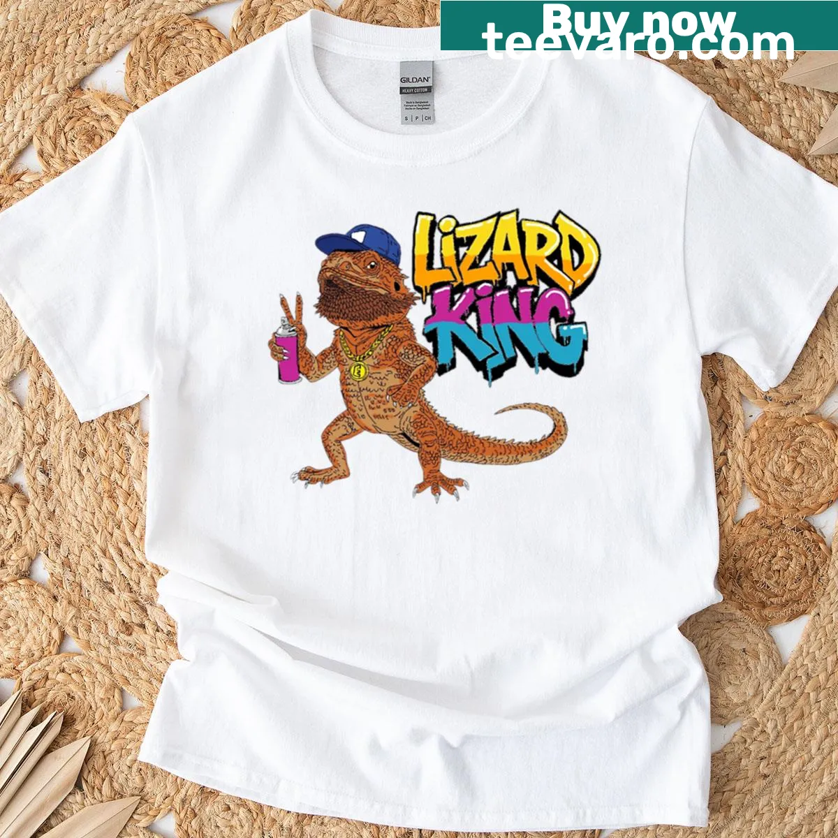 Whimsical illustration of a crowned lizard character — on a men's t-shirt