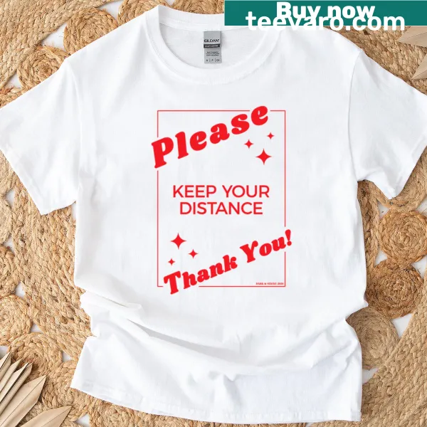 Illustrative 'Please Keep Your Distance' graphic on red t-shirt