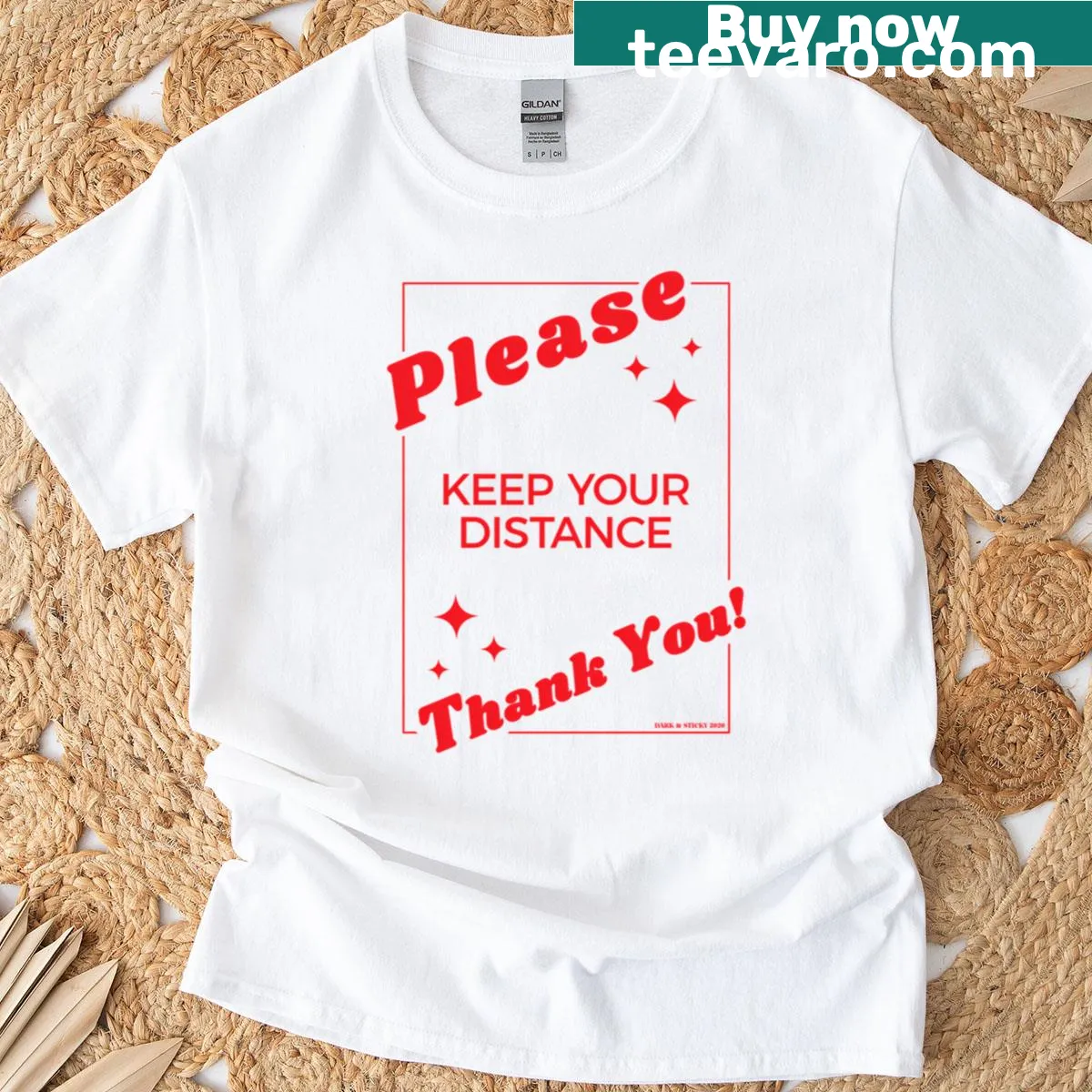 Illustrative 'Please Keep Your Distance' graphic on red t-shirt — on a men's t-shirt
