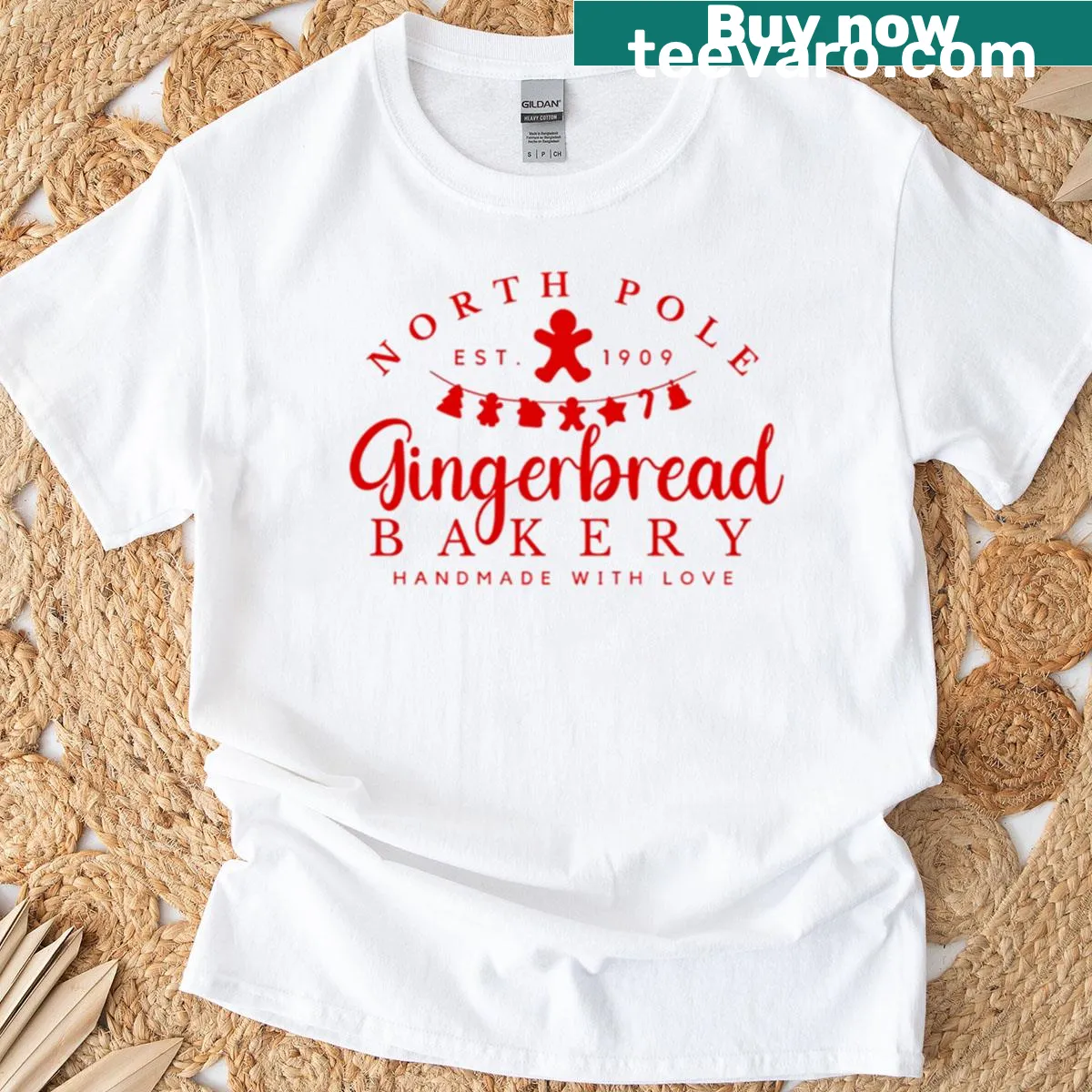 T-shirt featuring North Pole gingerbread bakery illustration — on a men's t-shirt